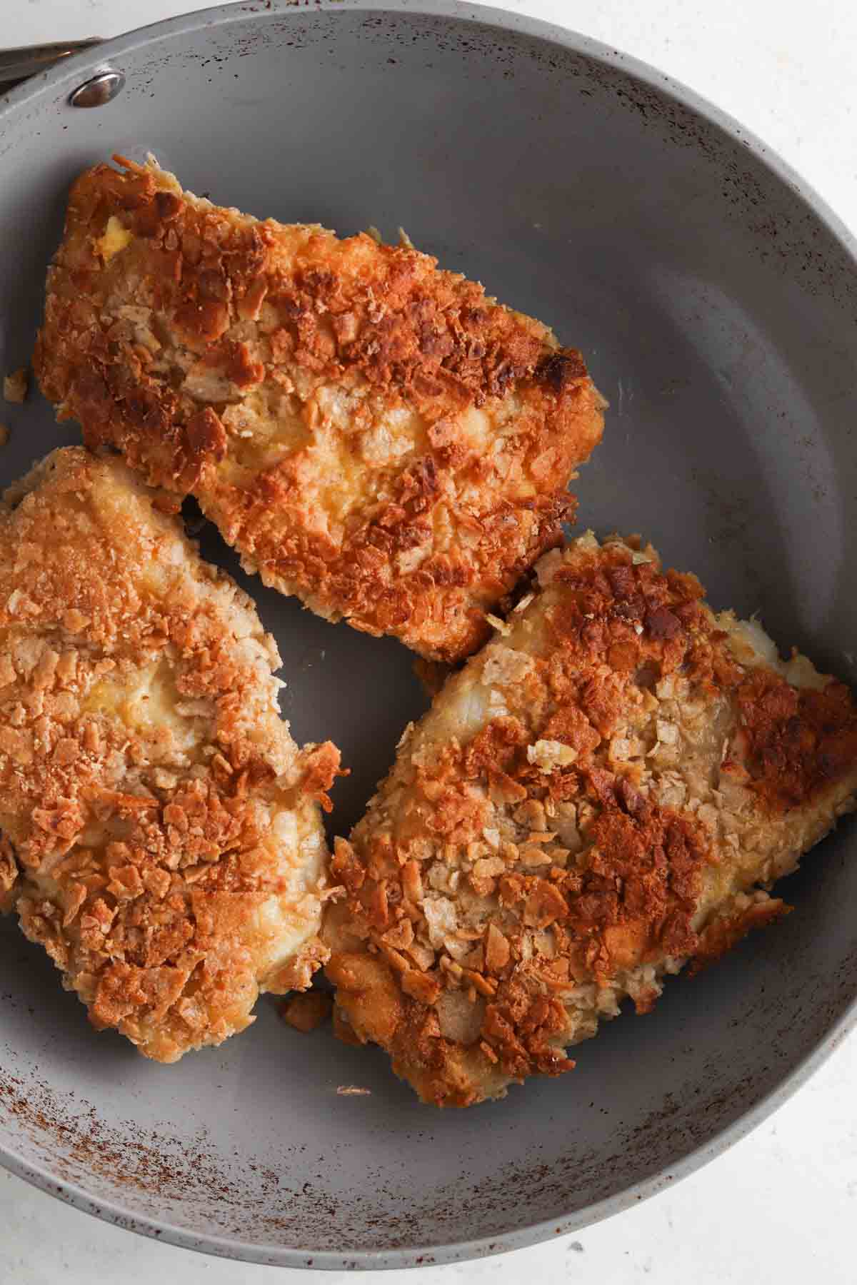 Fried dish in a large frying pan.