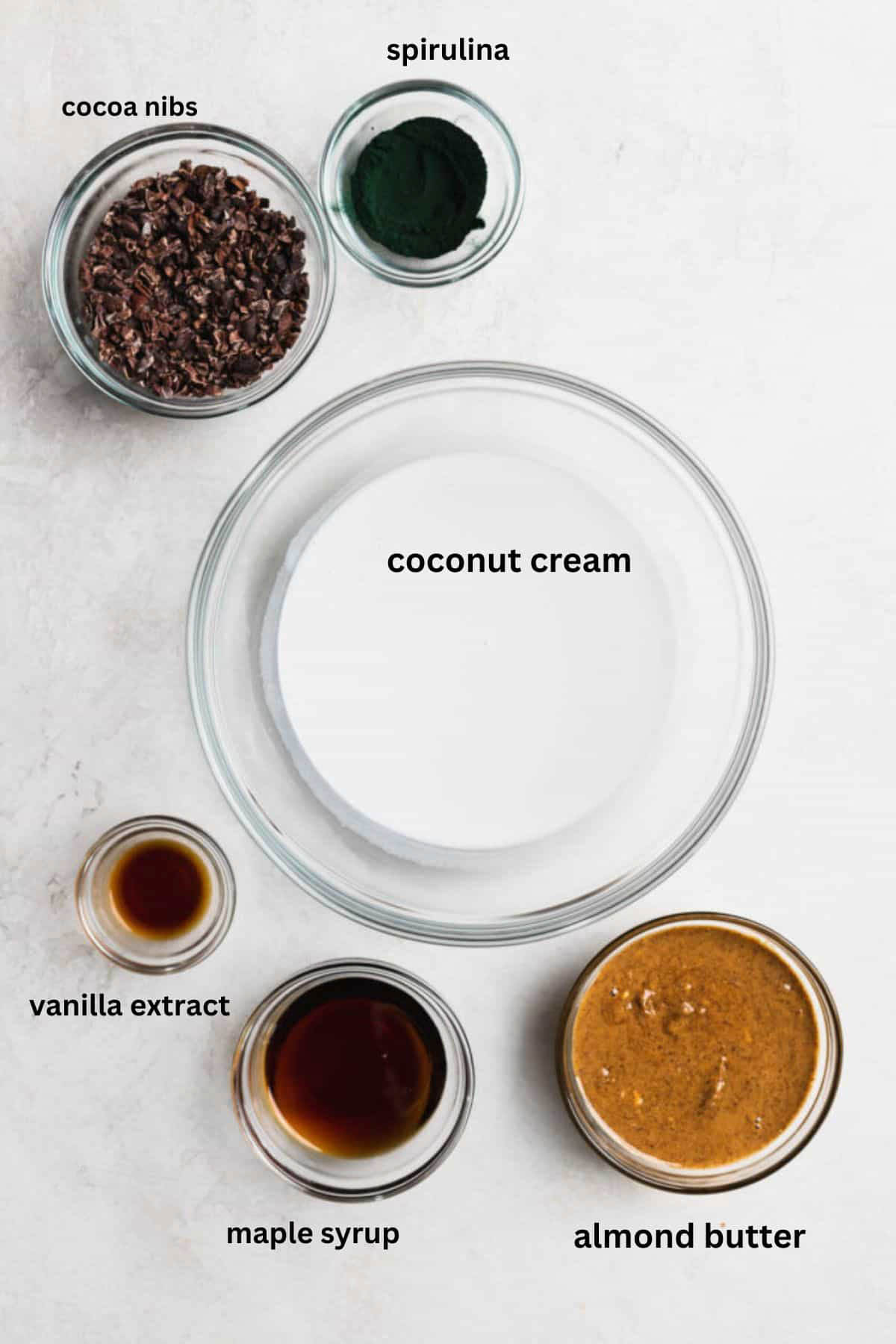 Paleo mint cookie bar ingredients in small glass bowls.