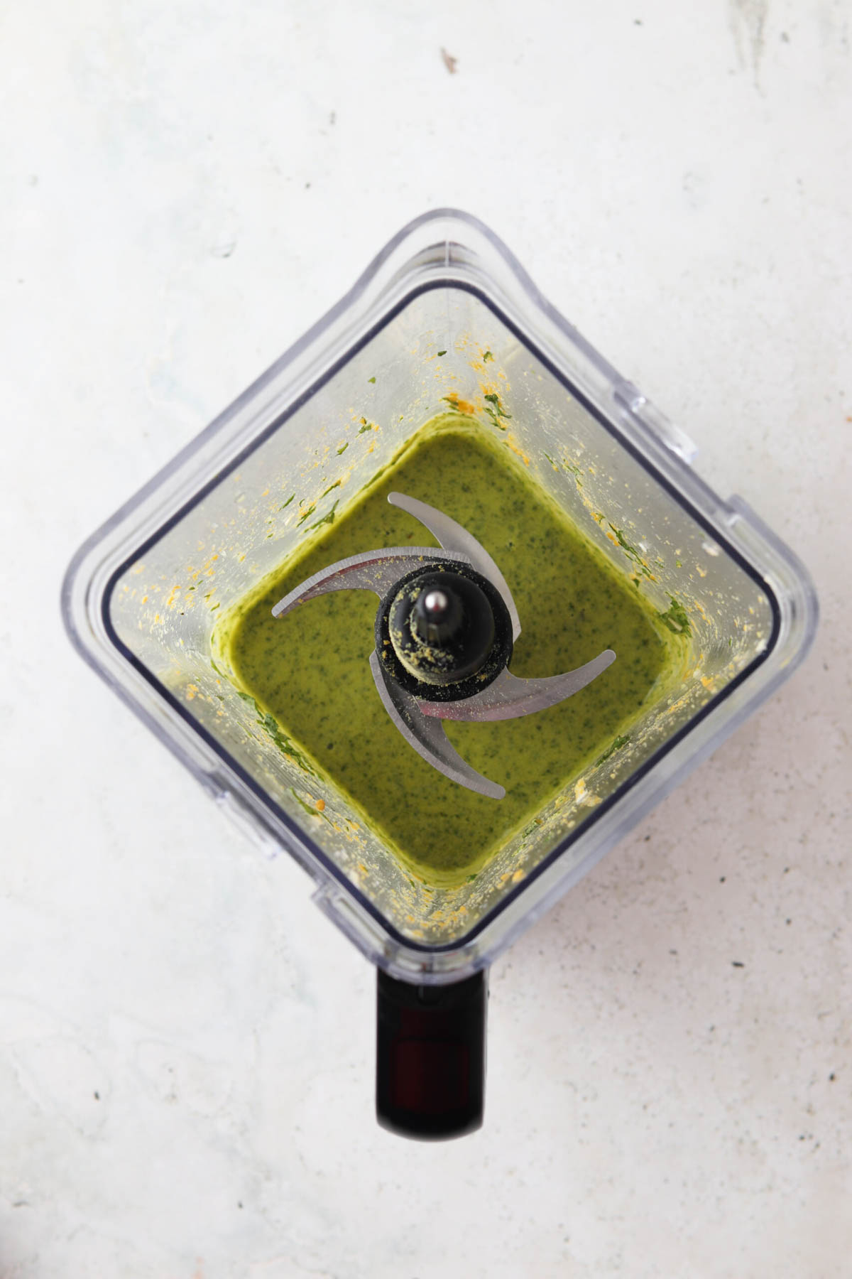 Whole30 pesto blended up in a blender base until smooth.