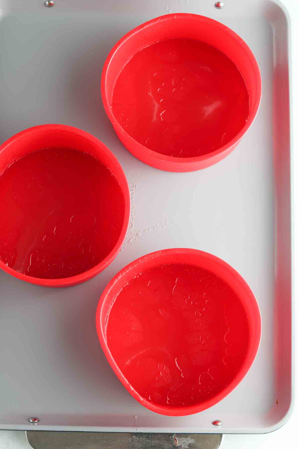 Cake pans with cooking spray oil.