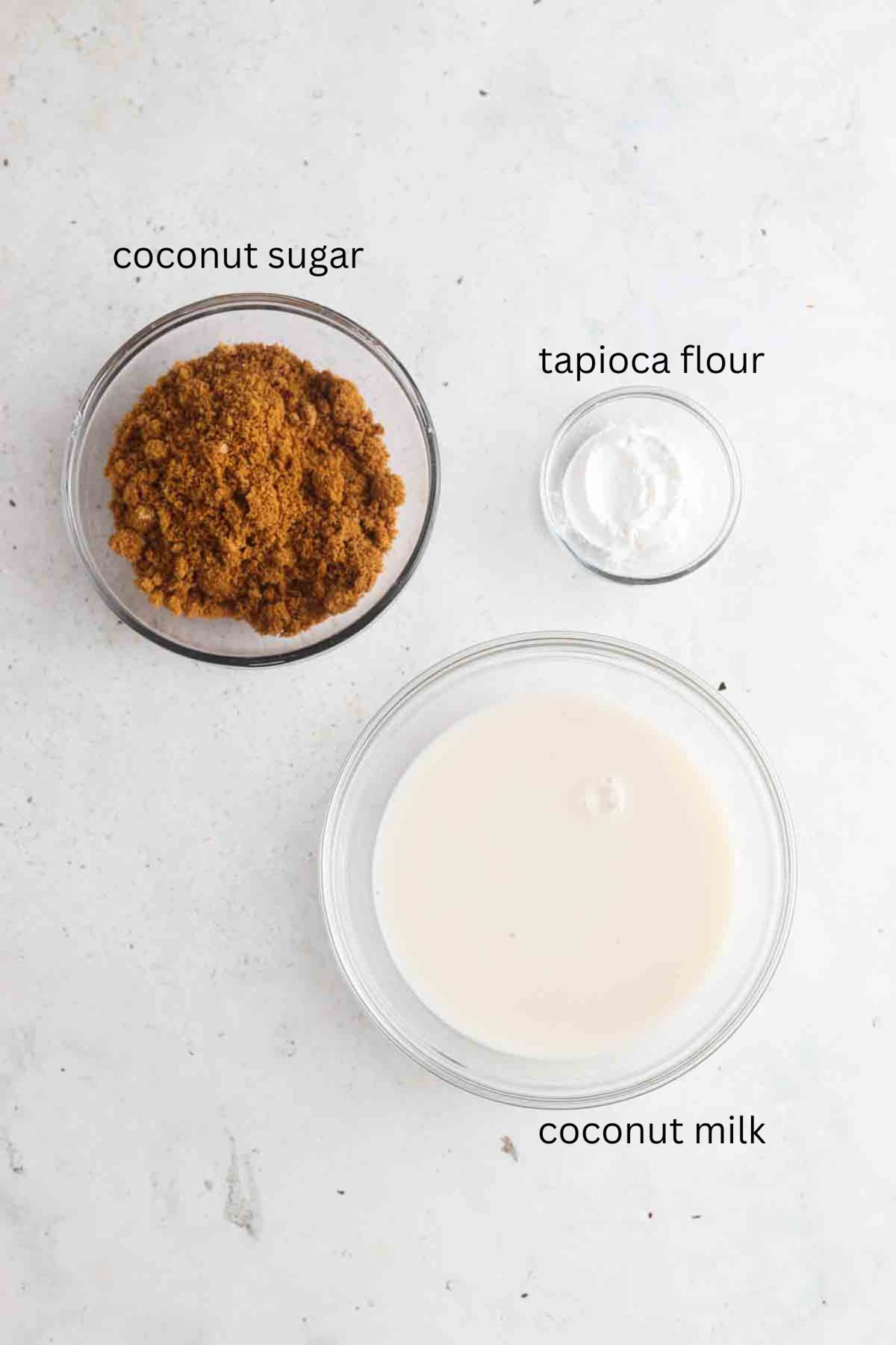 Vegan caramel sauce ingredients in small glass bowls.
