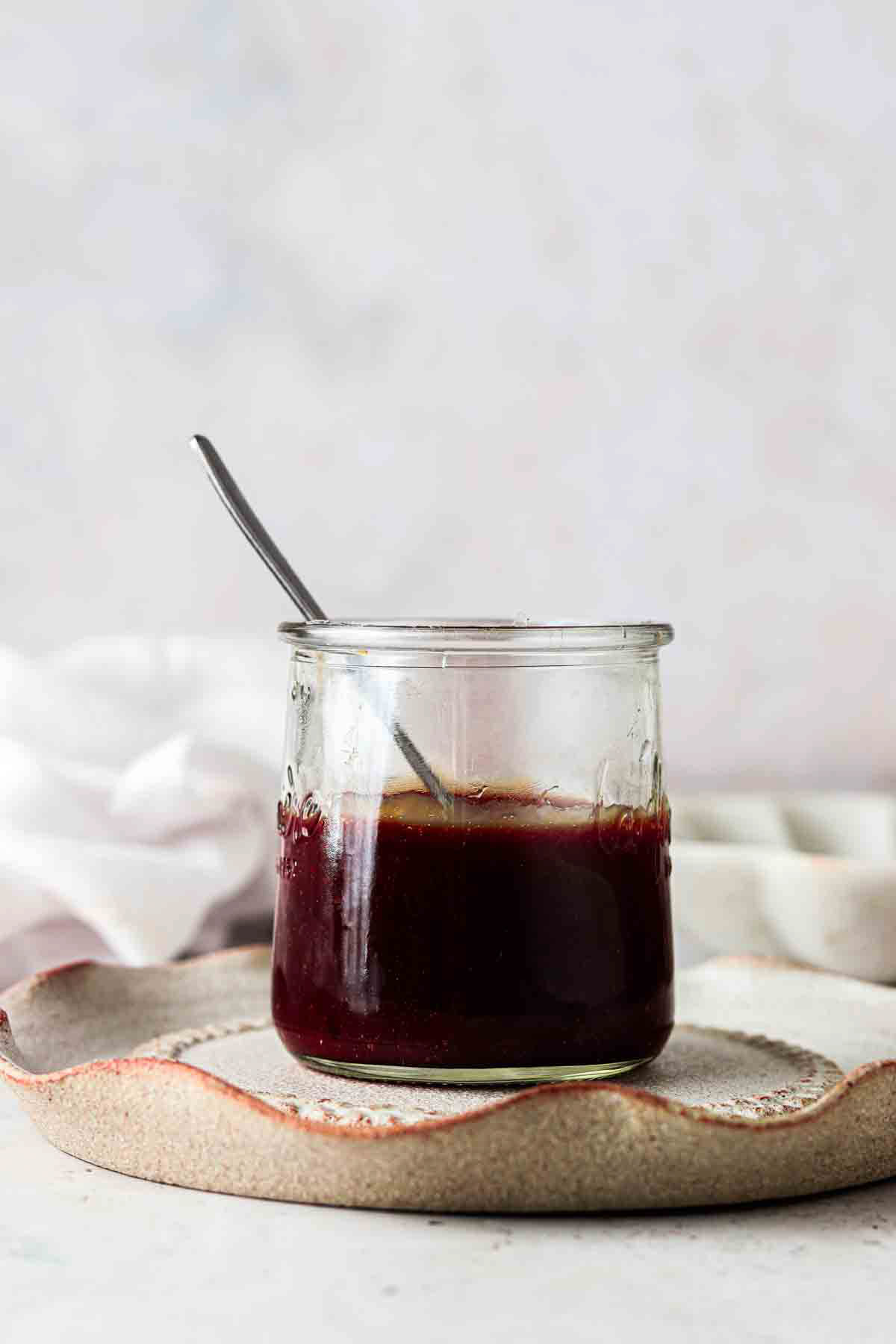 Dairy free caramel sauce hanging from a spoon.