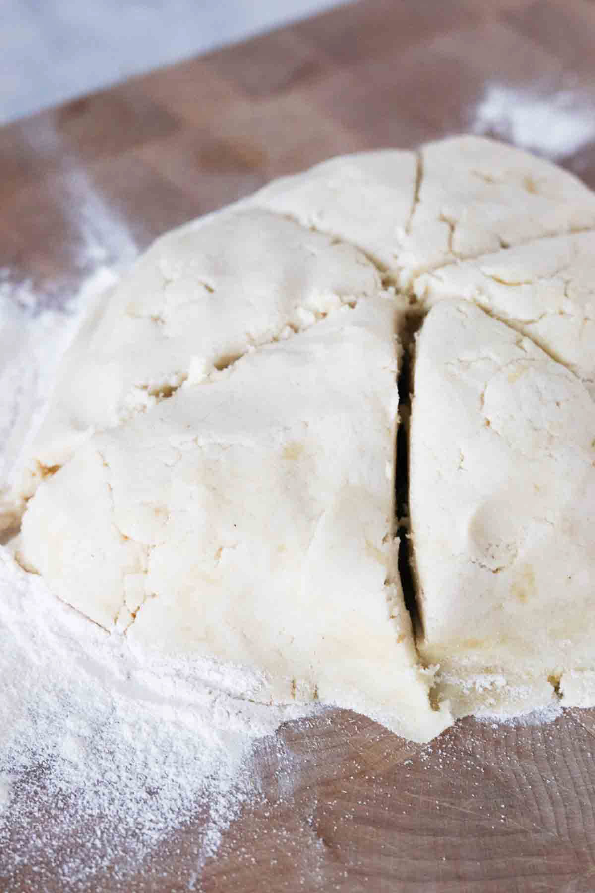 Pizza dough ball cut into fifths.