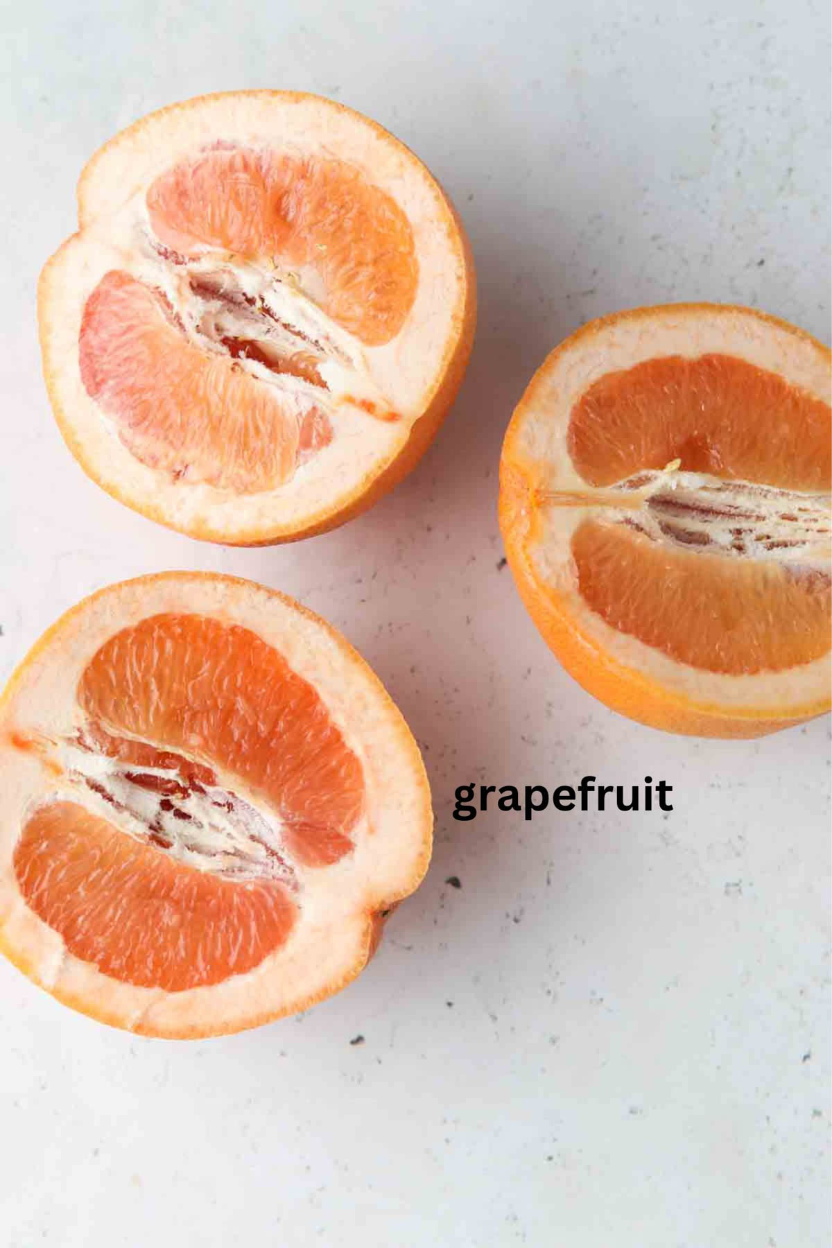 Grapefruits sliced in a half.