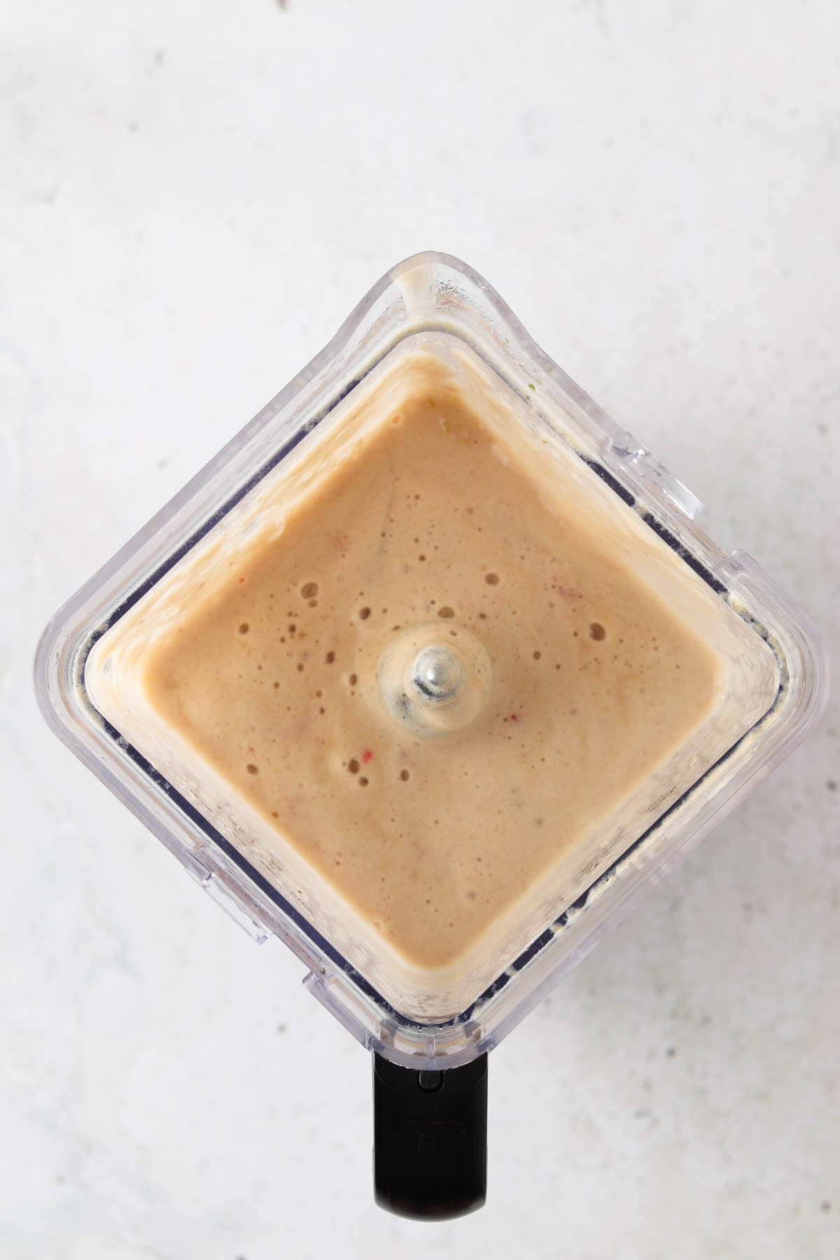 Smooth strawberry banana smoothie in a food processor. 