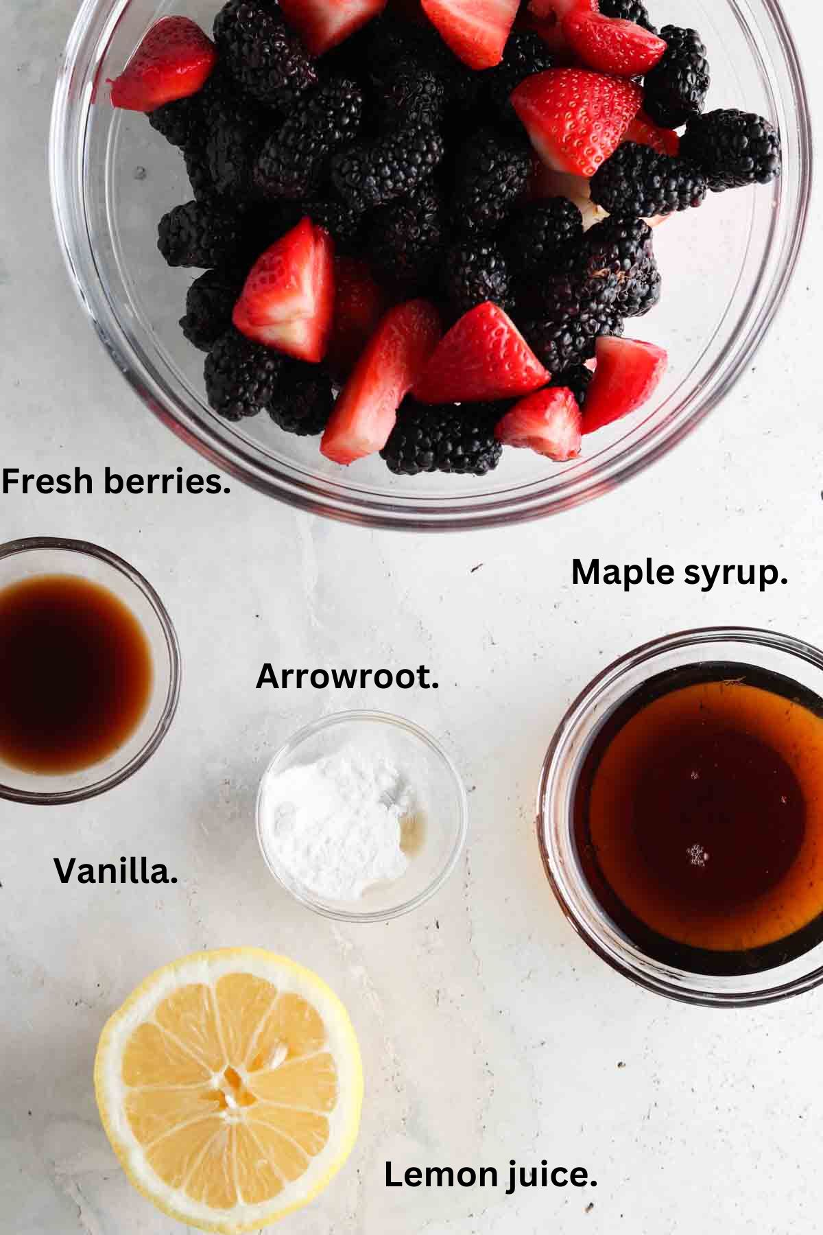 Blackberry crisp filling ingredients laid out in small glass bowls.