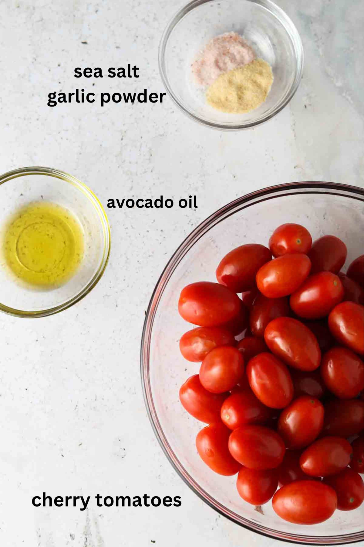 Air fryer roasted tomato ingredients in small glass bowls.