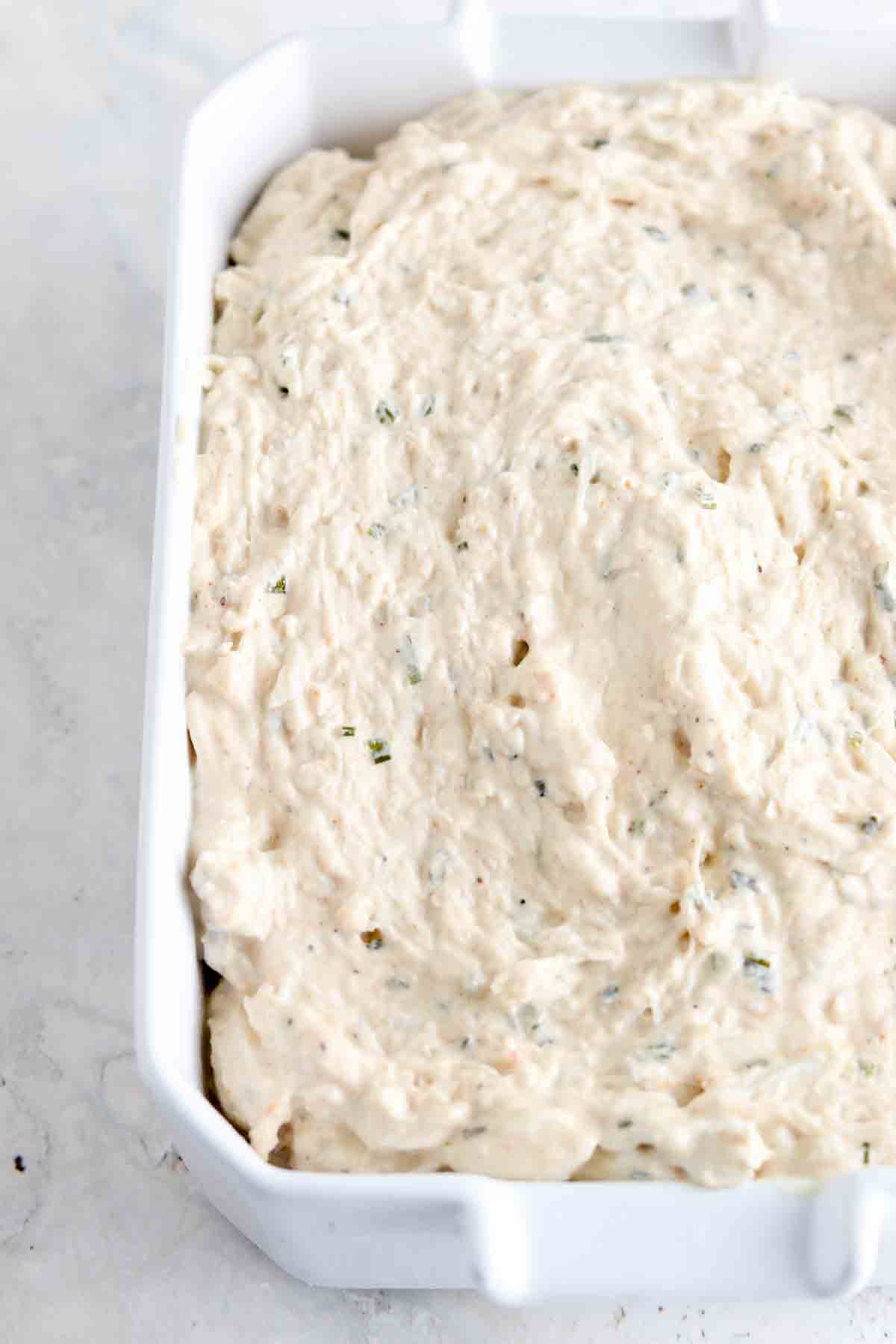 Crab dip in a casserole dish.