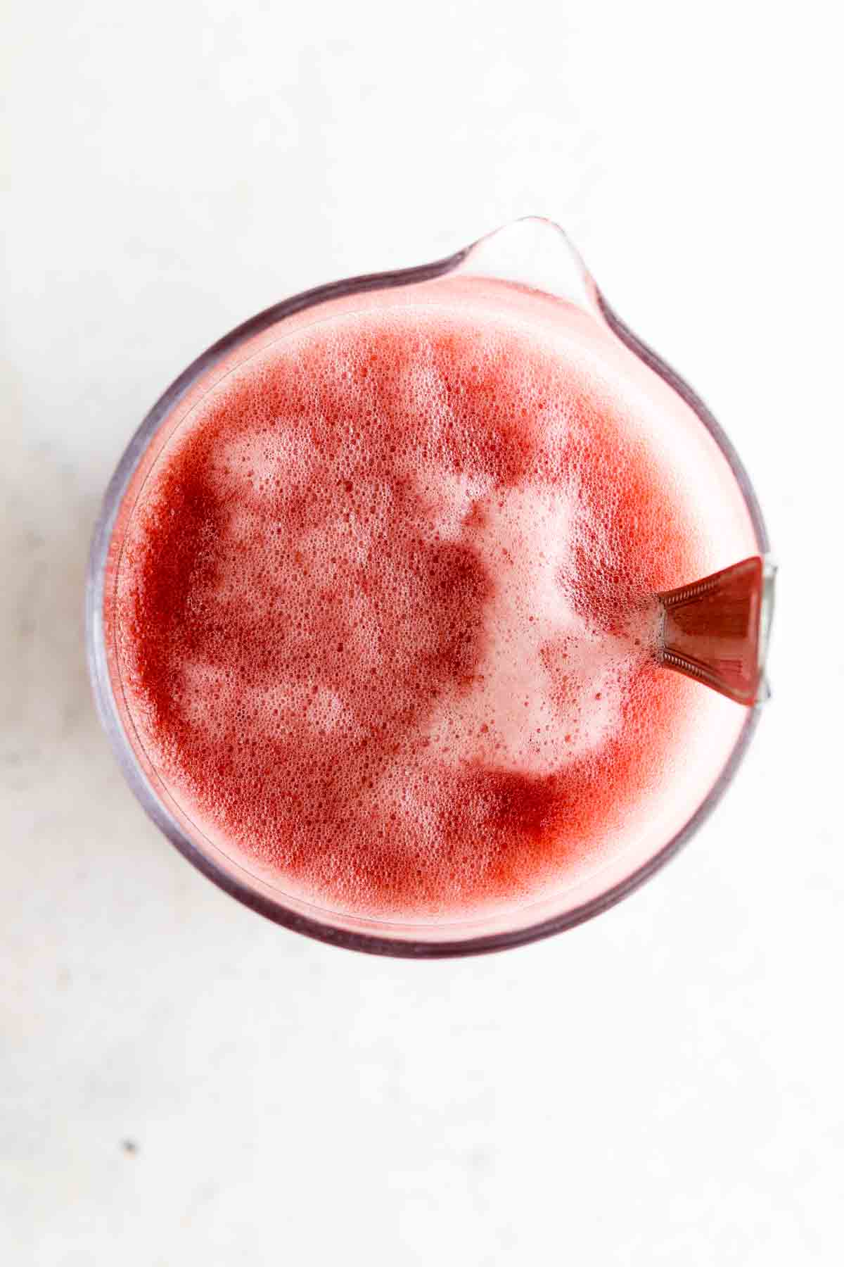 Cherry juice, club soda, and magnesium in a glass mixed together. 