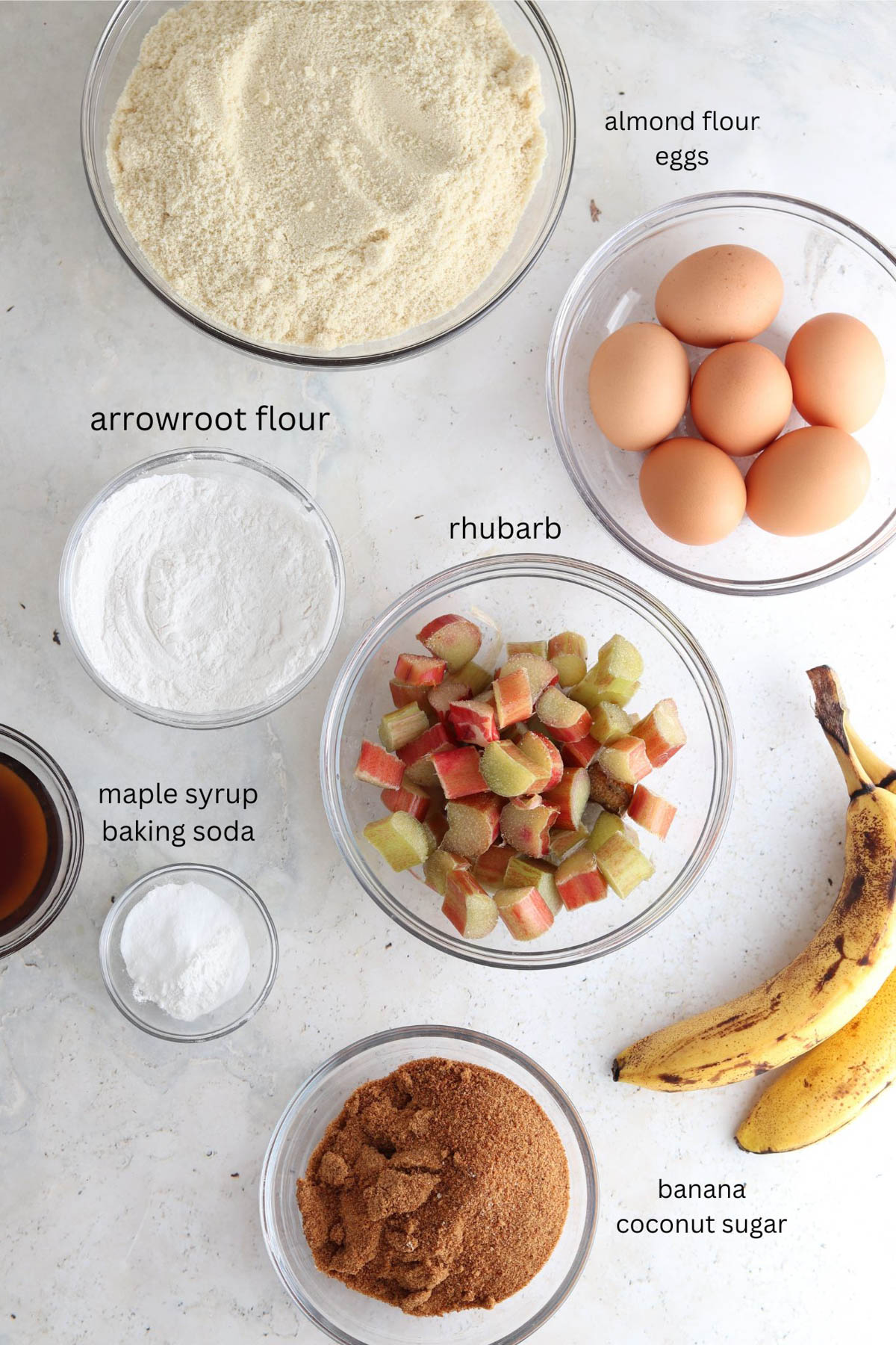Gluten free rhubarb cake ingredients in small glass bowls.