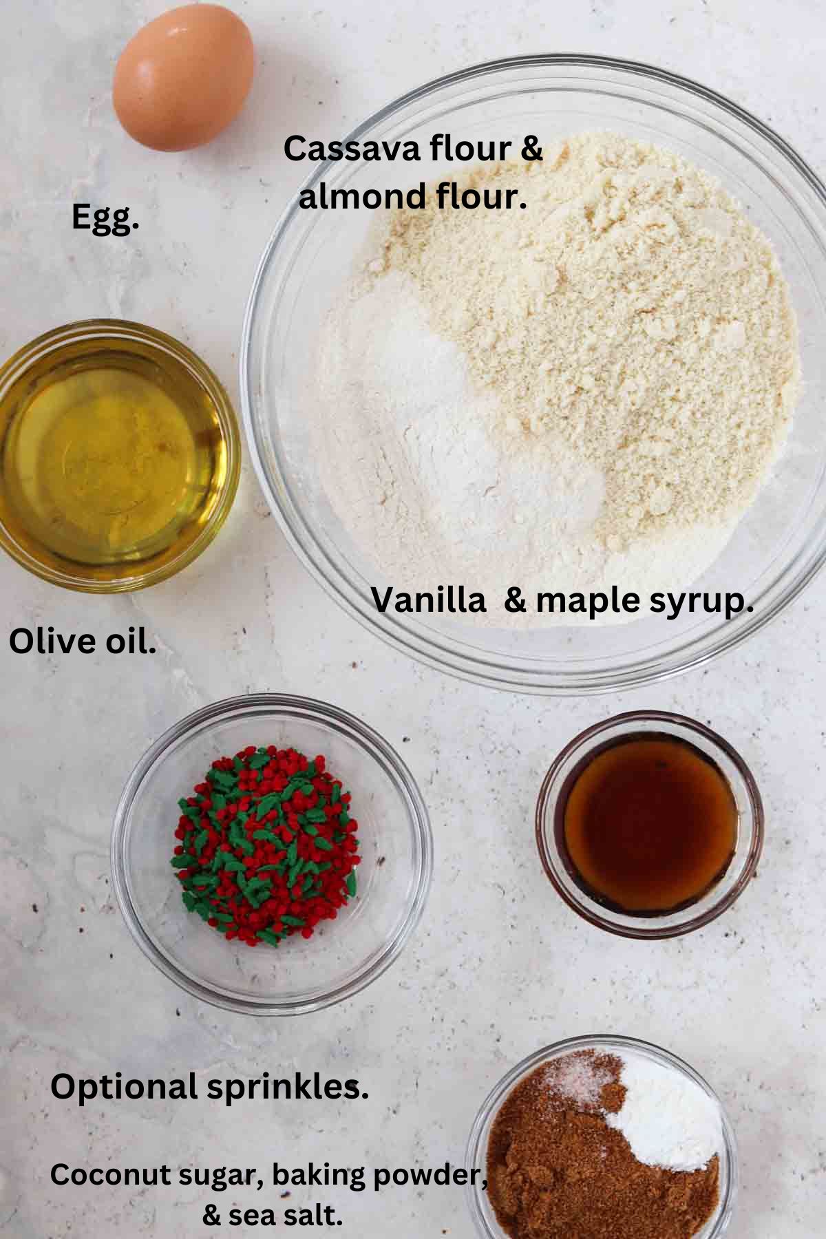 Cookie ingredients laid out in small bowls.