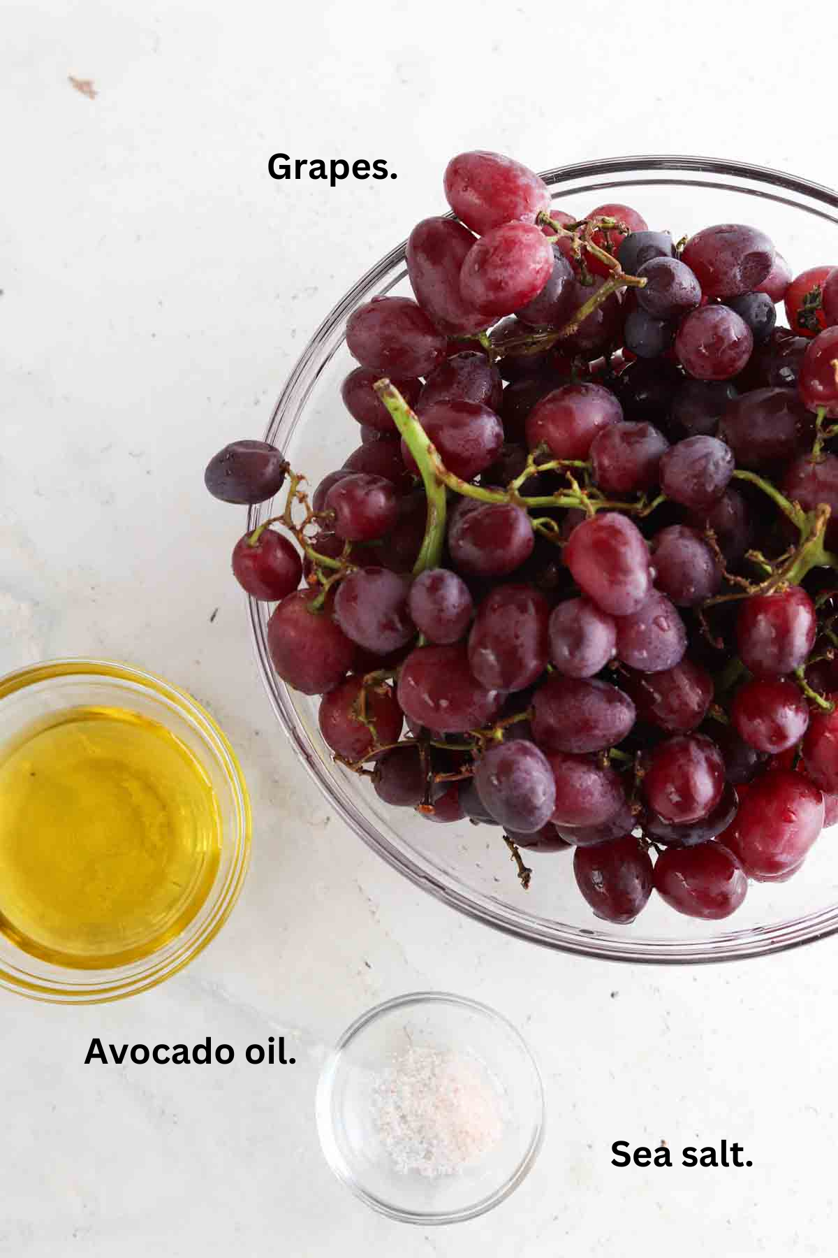 Roasted grape ingredients laid out in small glass bowls on the counter. 