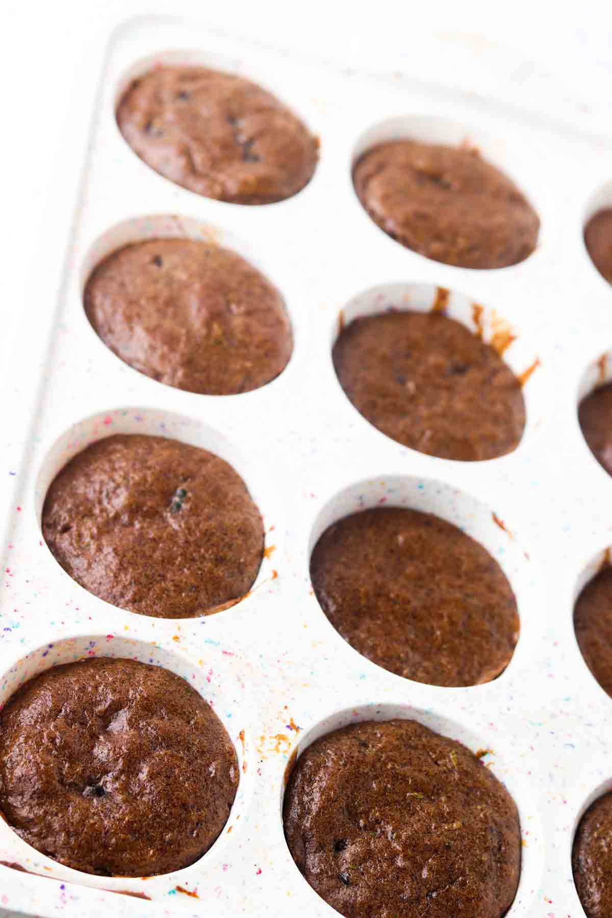 Zucchini muffins in a pan.