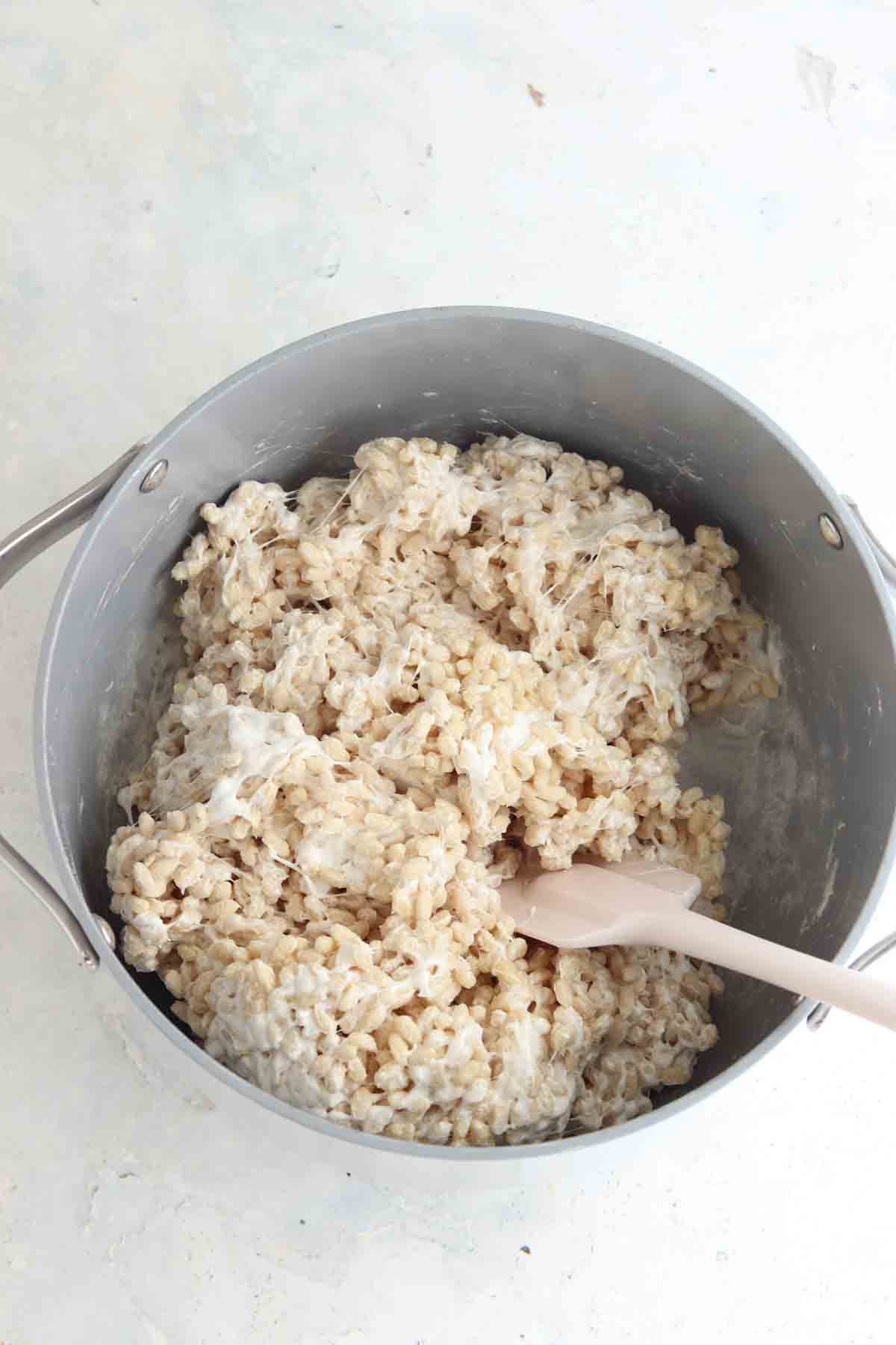 Rice cereal, vanilla extract, sea salt, butter and marshmallows in a large dutch oven.