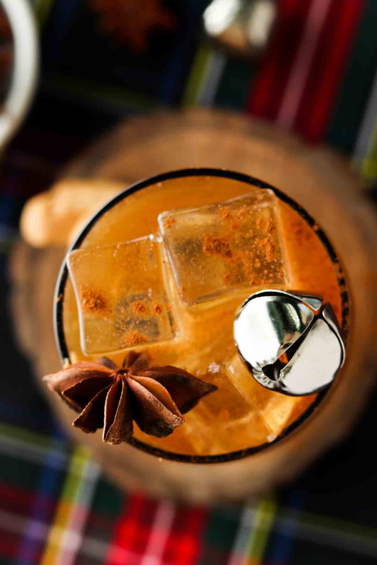 Looking down into a brown glass with a gingerbread drink in it. 