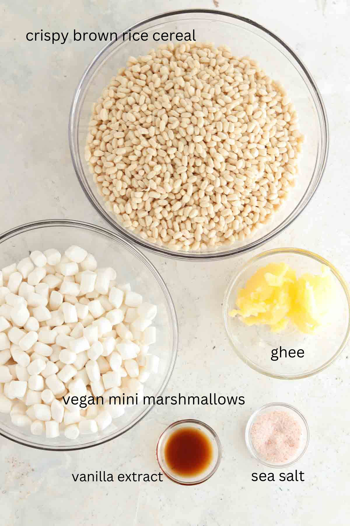 Gluten free rice crispy treat ingredients in small glass bowls.