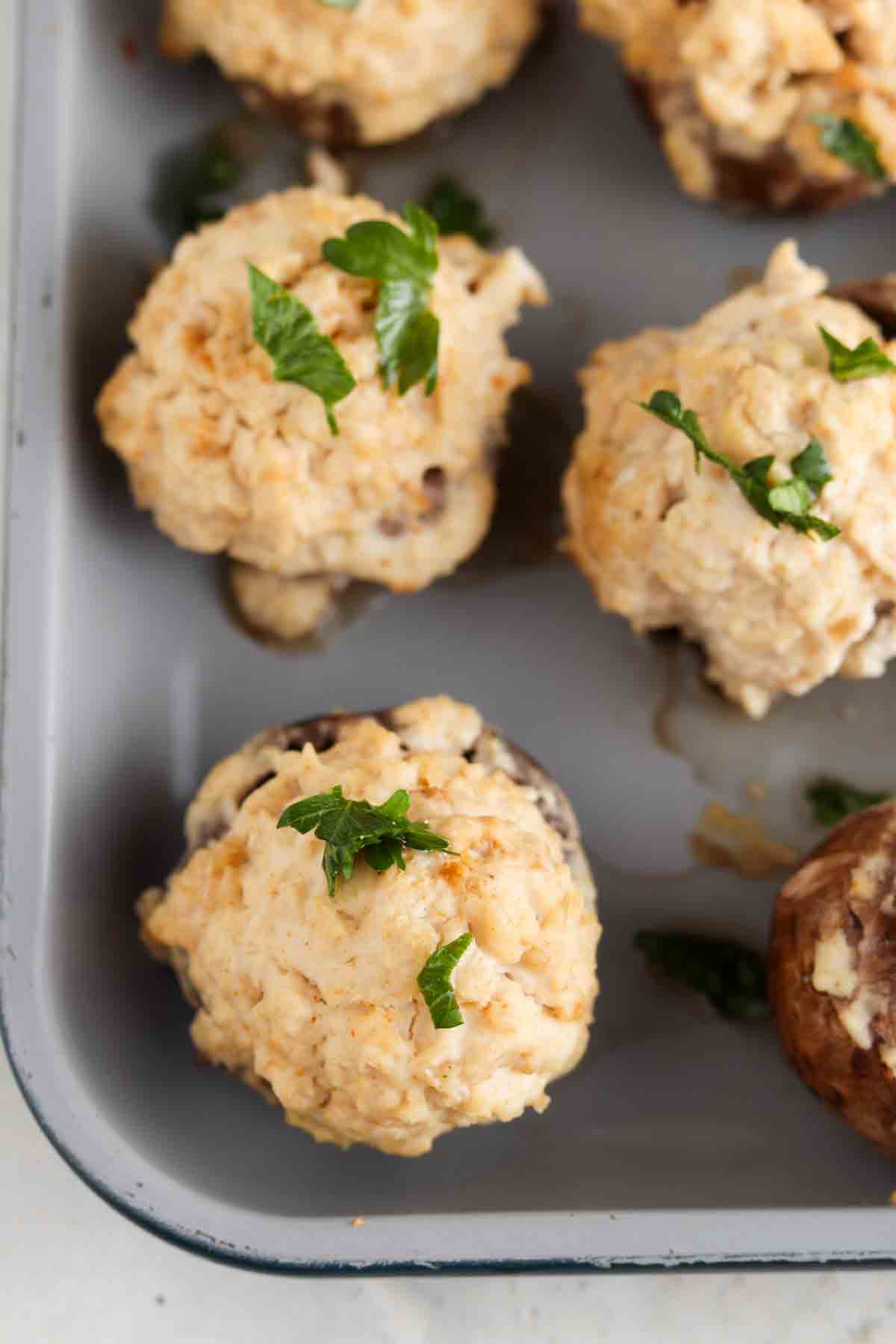 Baked stuff mushrooms on a baking sheet.