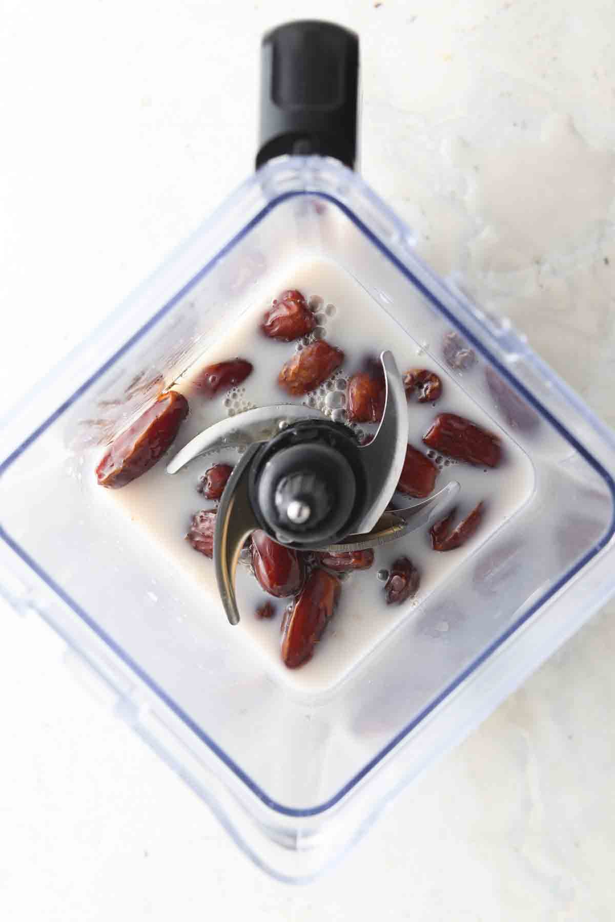 Dates, coconut milk, maple syrup and salt in a food processor. 