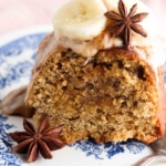 Slice of banana cake on a blue and white plate.