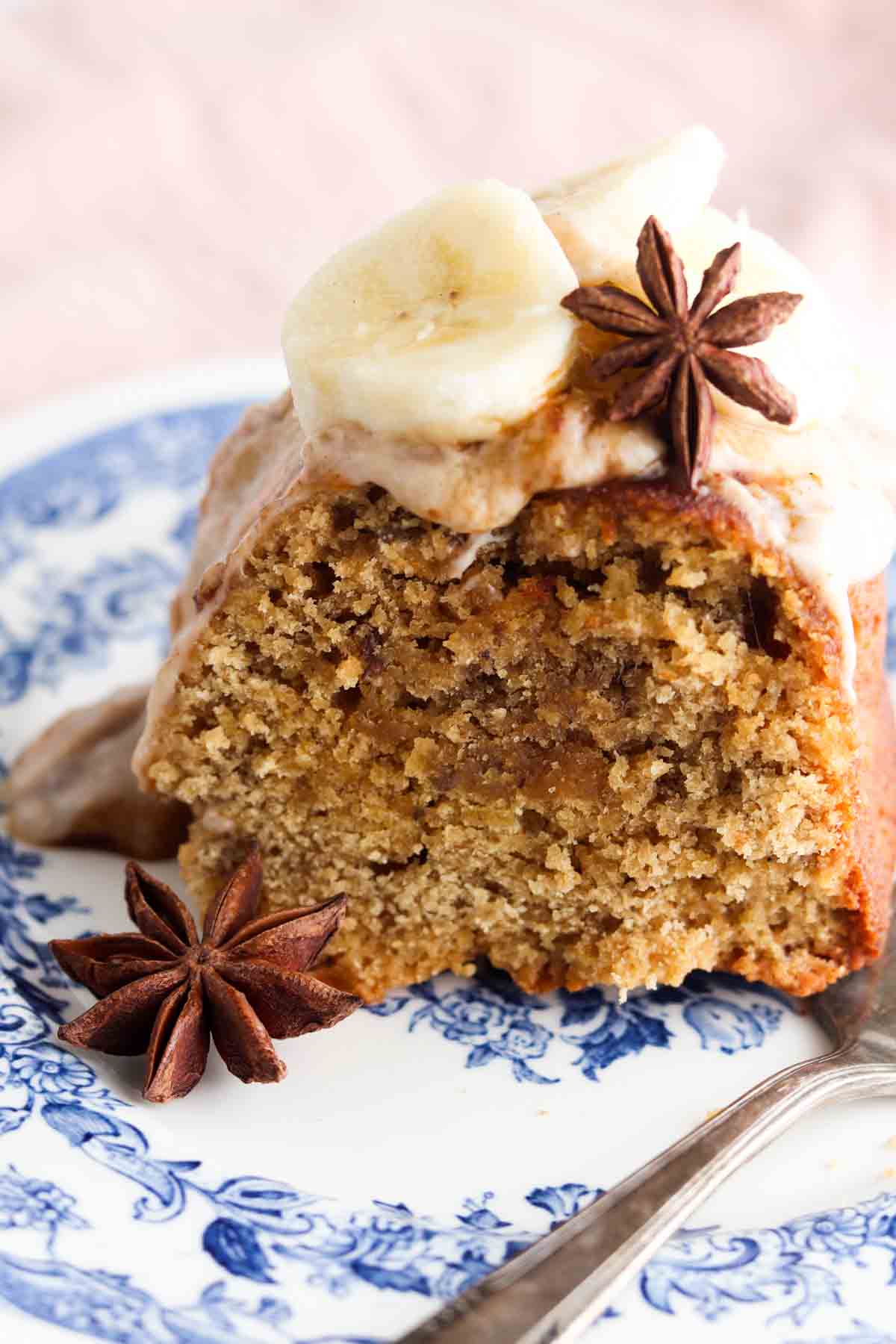 Slice of banana cake on a blue and white plate. 